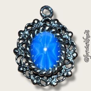 Silver-Tone Pendant with Blue Cabochon Sapphire Glass Center